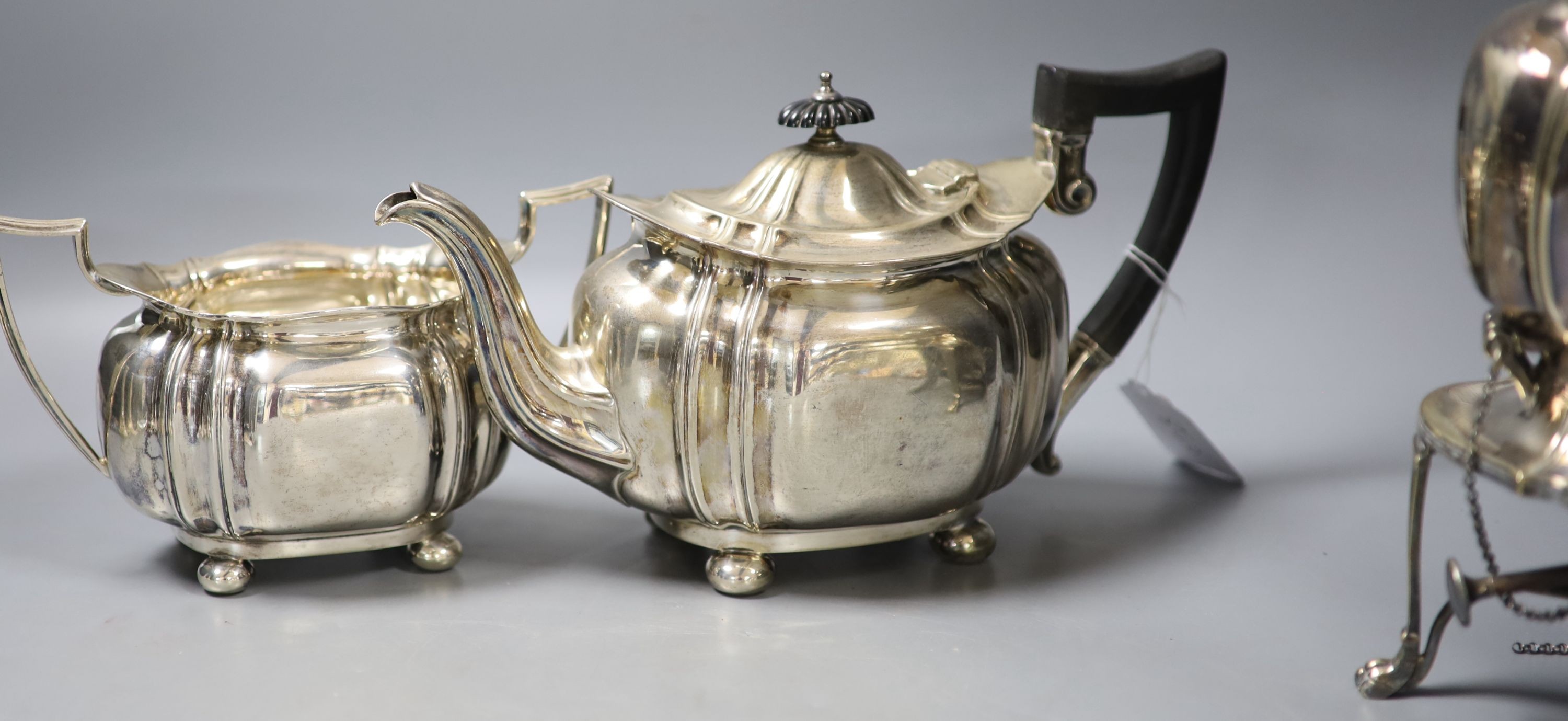 A George V silver three piece tea set, Cooper Brothers & Sons, Sheffield, 1913, gross 42oz, together with a similar plated tea kettle on stand with burner.